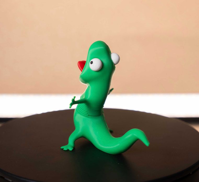 Рухома іграшка ящірка Том на пружині з мультфільму Хопперс. 3D-Іграшка Lizard Tom.