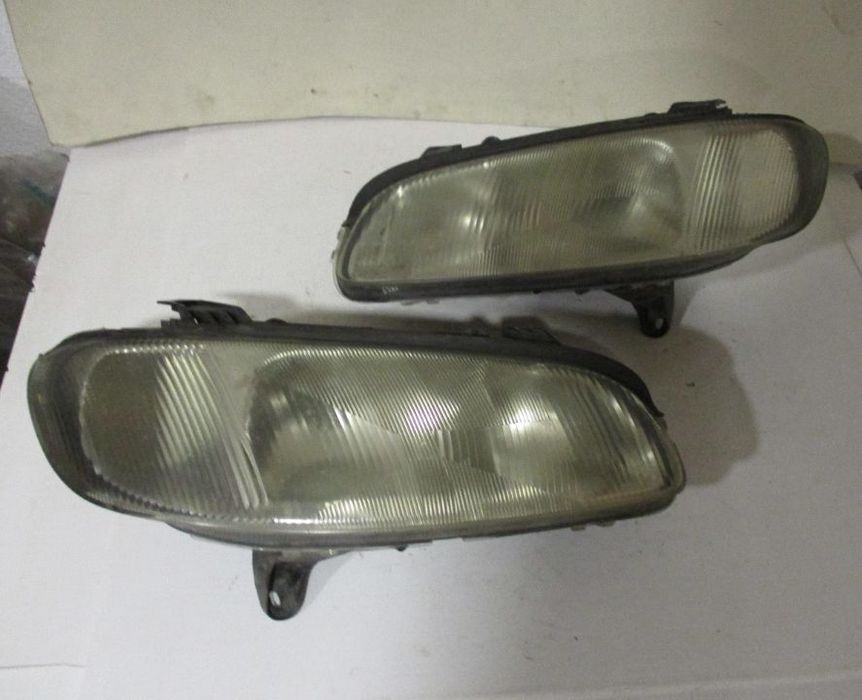 Farol Optica Opel Omega B Esq Dto