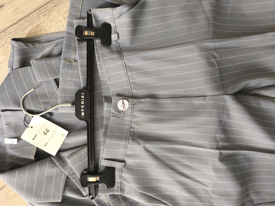 Брюки нові сірі в смужку