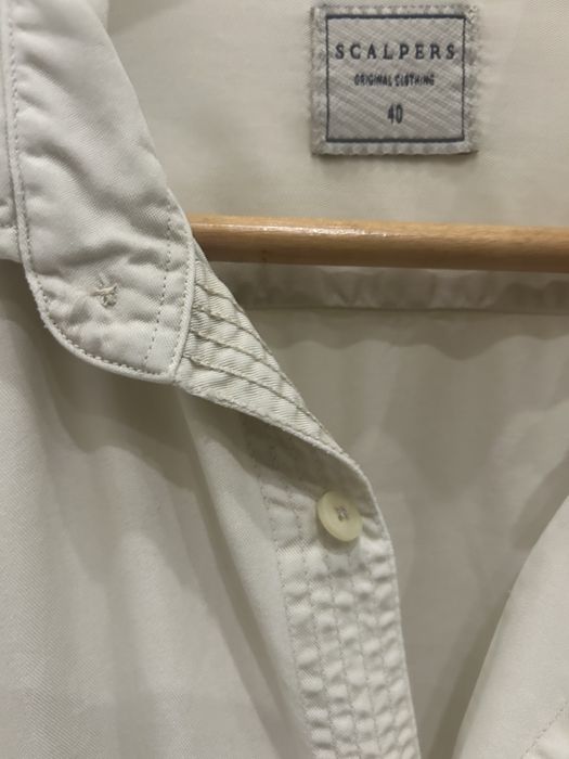 Camisa Scalpers como nova