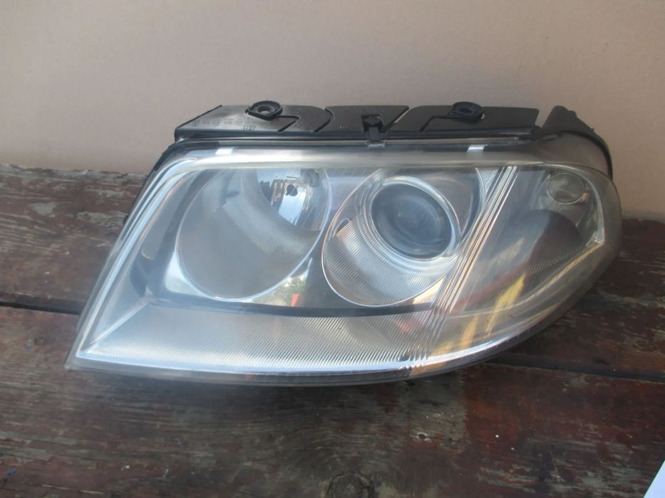 lampa lewa VW Passat B5 lift Hella Europa