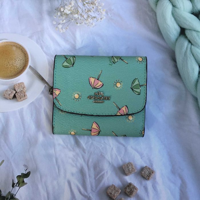 Carteira Coach Off-White com estampado de rosas