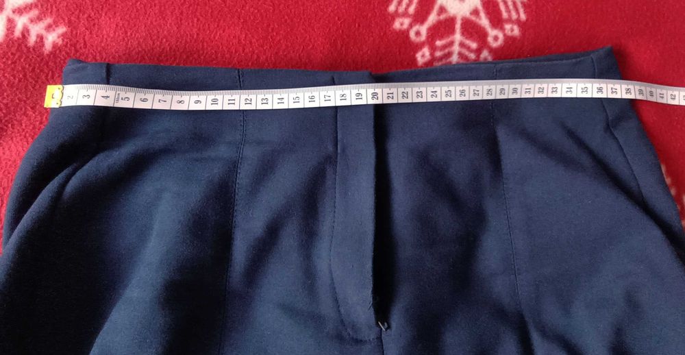 Eleganckie spodnie granatowe z rozciętą nogawką dołem Reserved
