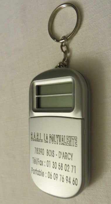 Porta Chaves Calculadora e conversor -Funciona  1 pilha - 8x4 cm