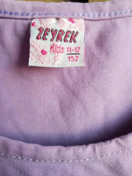Sliczna bluzka fioletowa  rozm 152