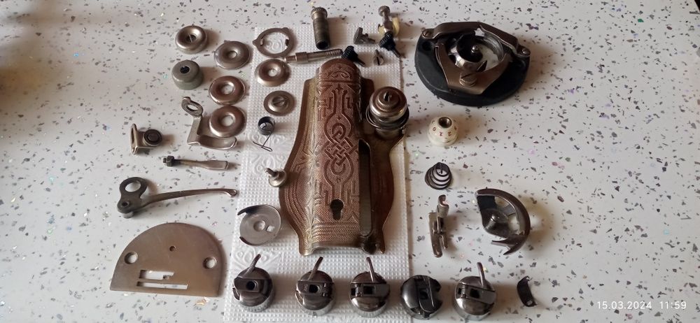 Запчасти швейной машинки.