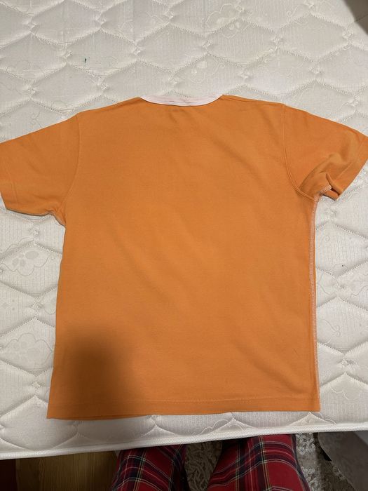 T-shirt laranja da marca polaca H.I.S Jeans.