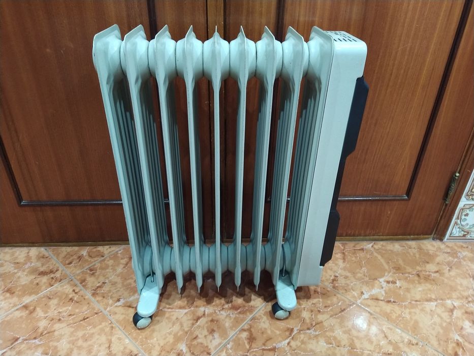 Aquecedor radiador a óleo  casa quarto apartamento vivenda escritório gabinete cozinha.