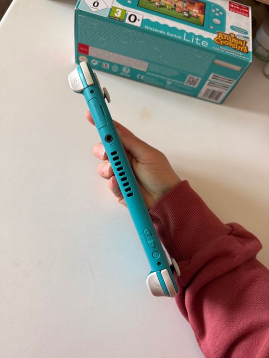 Nintendo Switch Lite c/película de vidro + capas