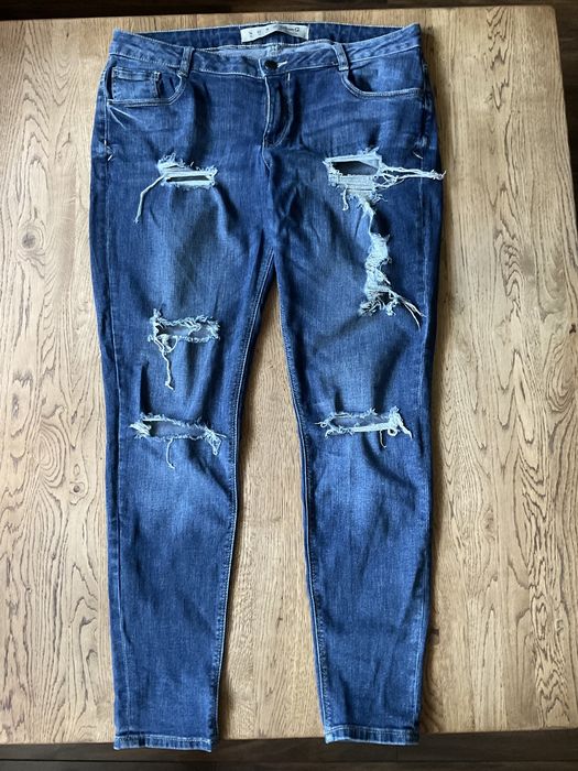Denim & Co spodnie z dziurami 42