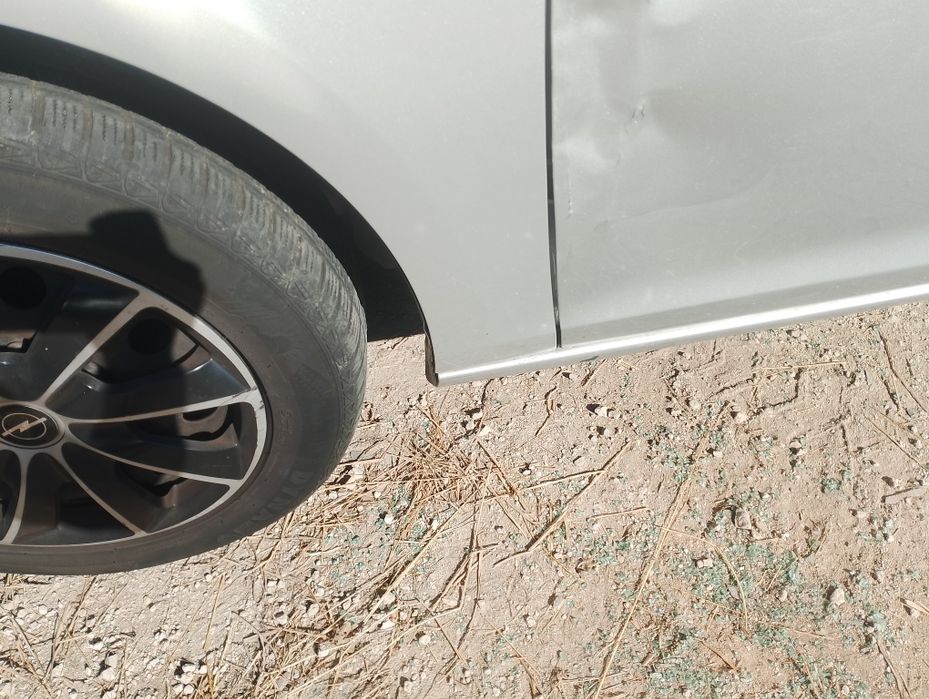 Błotnik opel astra j lewy