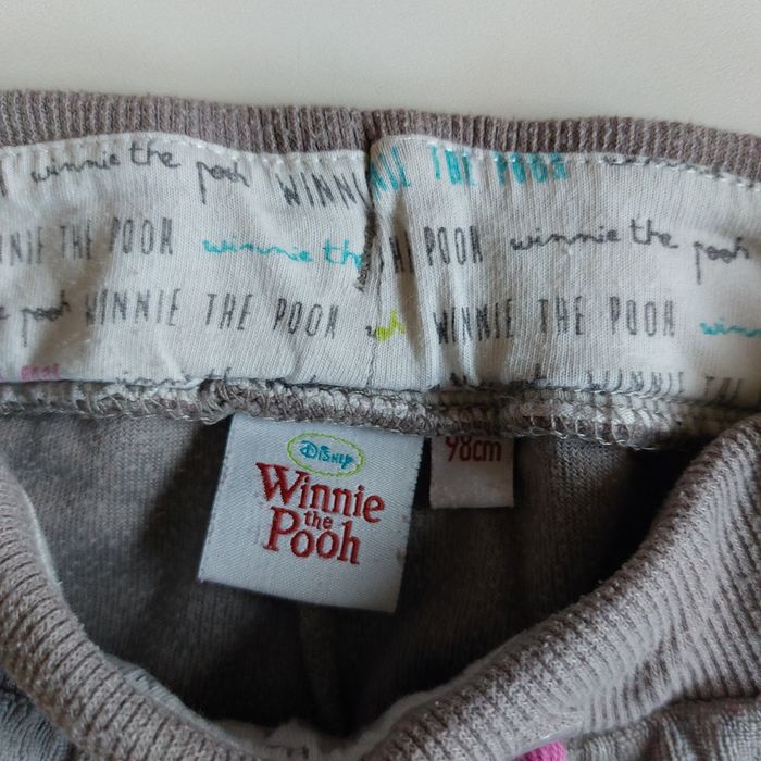 Beżowe spodnie dresowe legginsy Kubuś Puchatek Disney Next 98-104