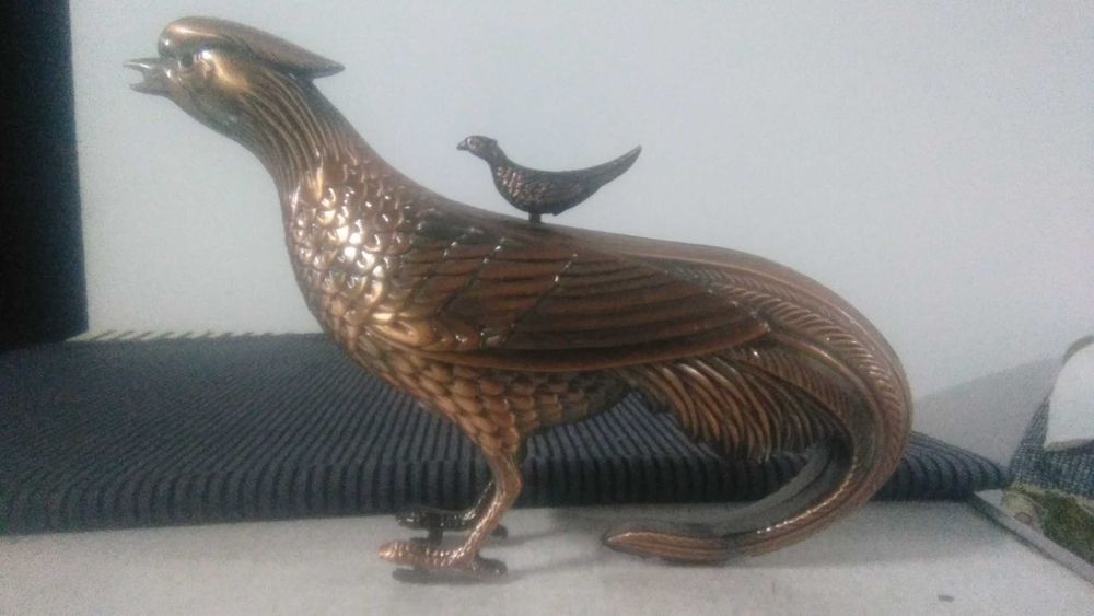 Isqueiro em forma de pássaro