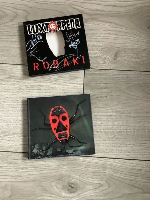 Luxtorpeda album CD Robaki z autografami