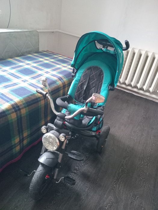 Продам отличный детский трехколесный велосипед-коляску Baby Tilly Tornado в красивом бирюзовом цвете.