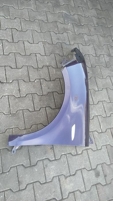 ) Lancia Ypsilon błotnik przedni lewy