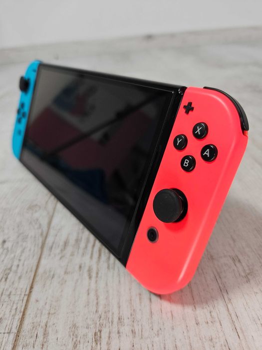 Nintendo Switch OLED Neon – idealny ekran, pudełko + gra TMNT – pełny zestaw