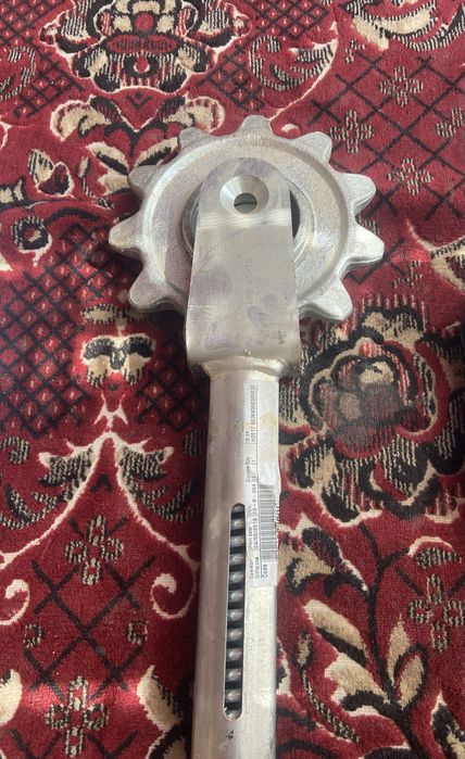 Механізм натягу мисового ланцюга із зірочкою