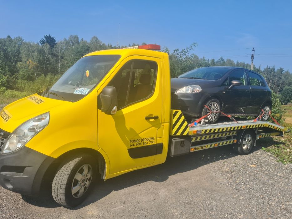 Pomoc drogowa-usługi transportowe lawetą-holowanie