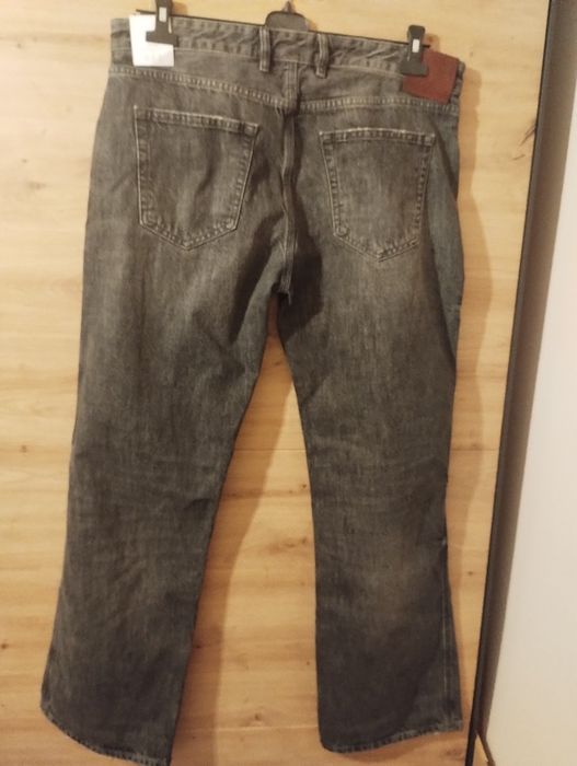 Męskie czarne spodnie jeansowe flare Zara r.44