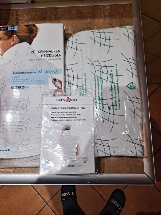 Wygrzewająca poduszka elektryczna na plecy i kark.