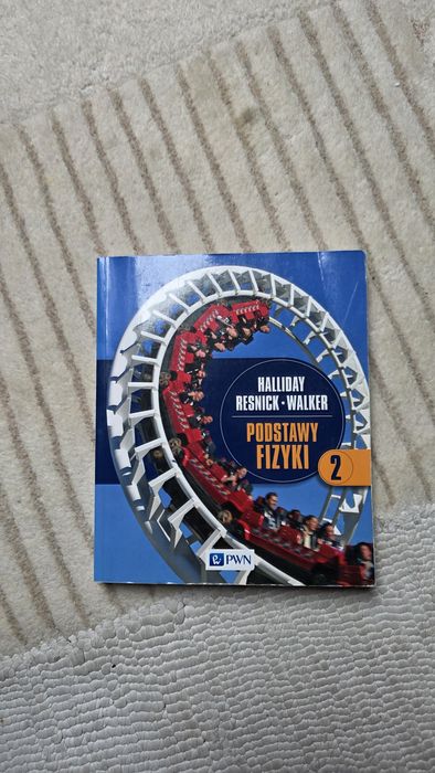 Podstawy fizyki. Tom 2” autorstwa Davida Hallidaya, Roberta Resnicka i Jearla Walkera,
