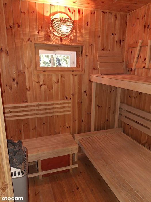 Domek letniskowy z sauną nad jeziorem, 1100m² ogrodzonego terenu.