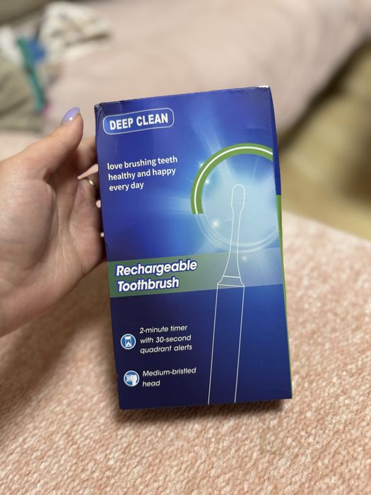 Новая электрическая зубная щетка