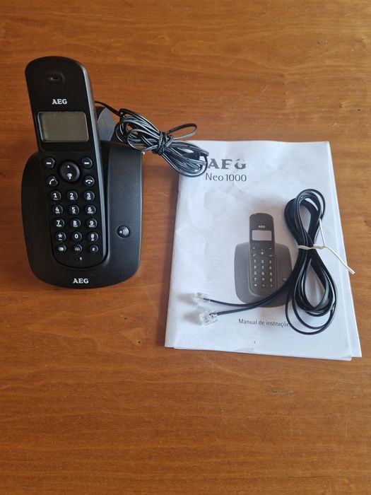 Telefone fixo "AEG Neo 100", com pilhas recarregáveis novas.