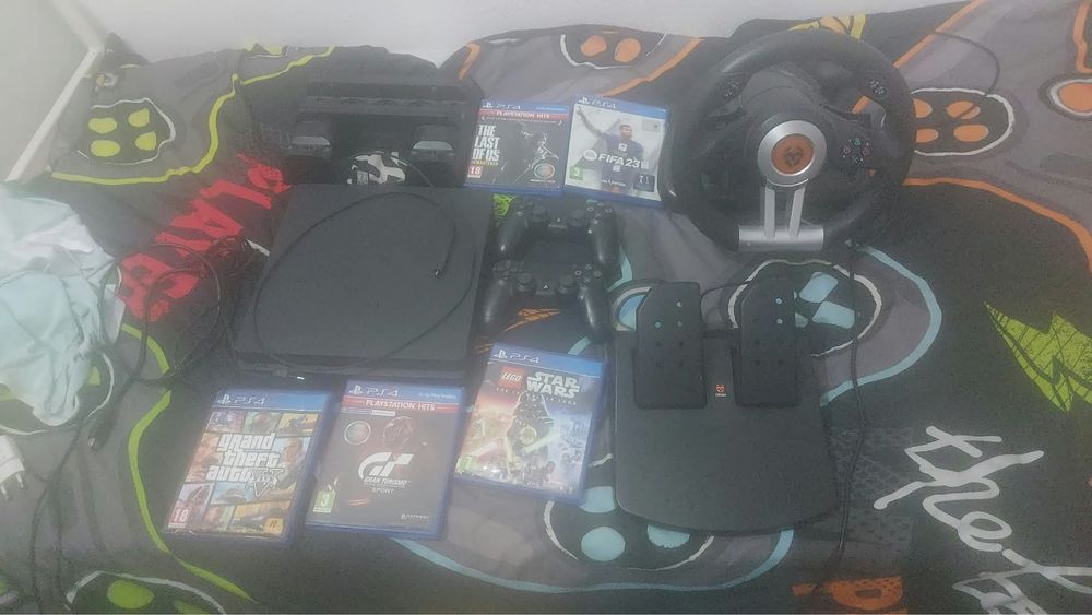 PS4 + 2 comandos + 5 jogos + base + volante (usado)
