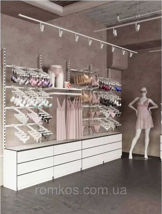 Настінне/пристінне торгове обладнання з металу  для магазинів одягу.