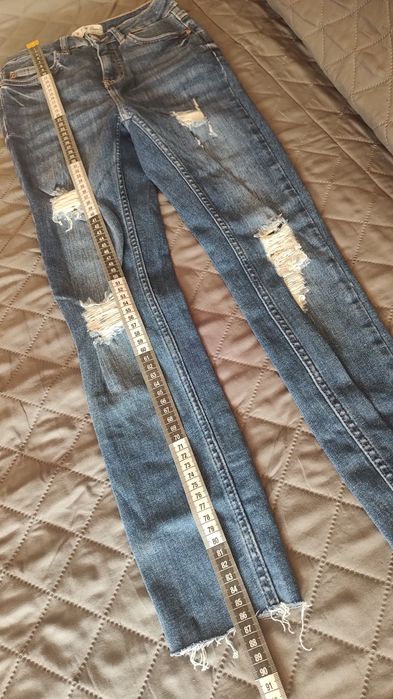 Spodnie z przetarciem DenimCo XS