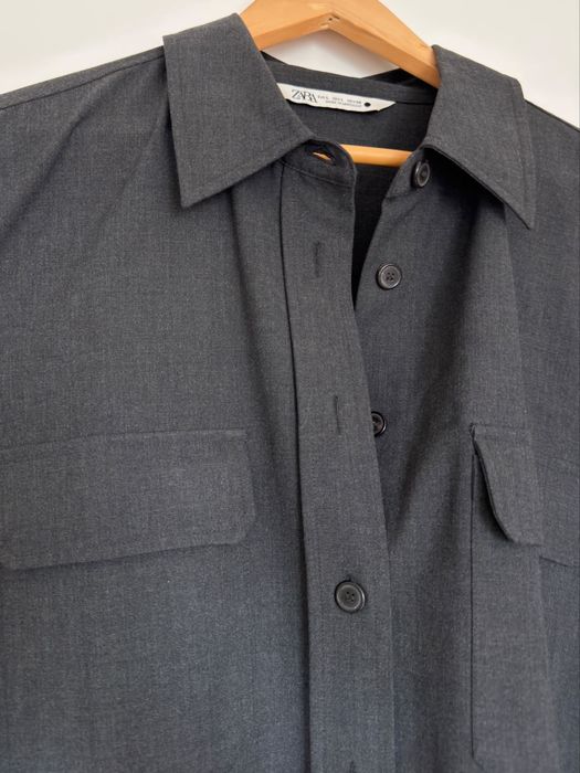 Camisa comprida com bolsos