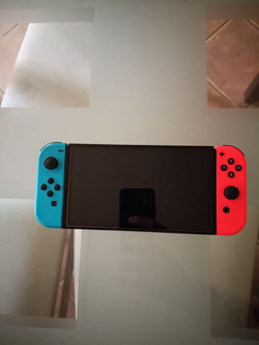 Nintendo Switch Oled Como Nova Com Quatro Jogos De Oferta