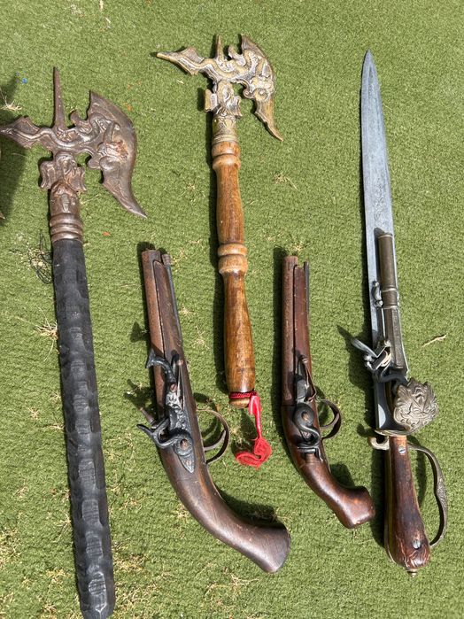 Box of replica artifacts including replica pistols