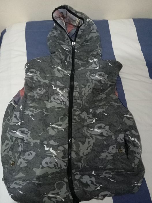 Colete reversível tamanho L em bom estado