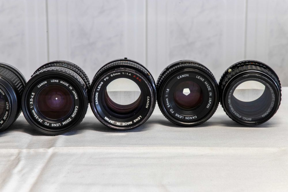 Lote de câmeras fotográficas+objetivas+acesórios