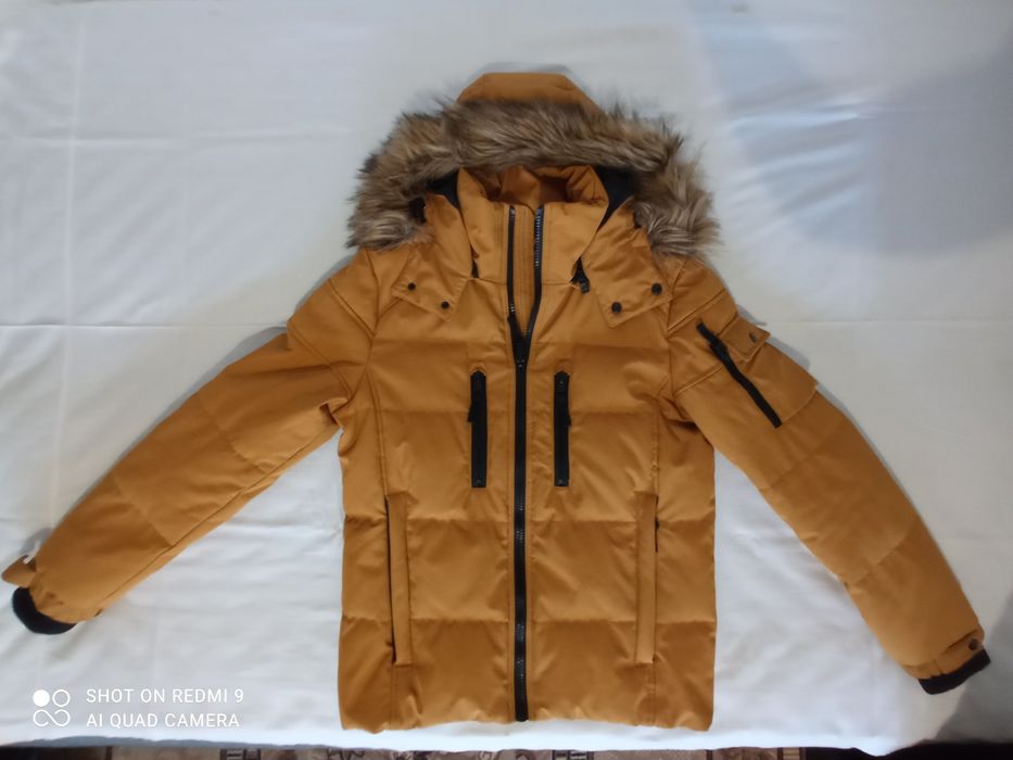 Продам пуховик Colins