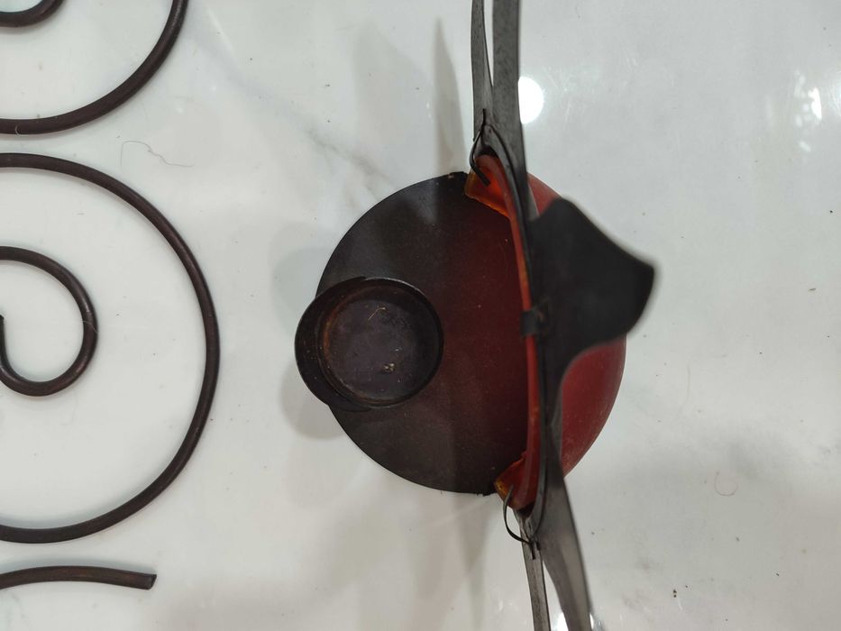 11 porta velas altos em metal e vidro com formato Sol