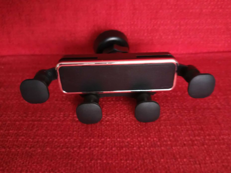 Suporte manual ajustável de telemóvel para viatura