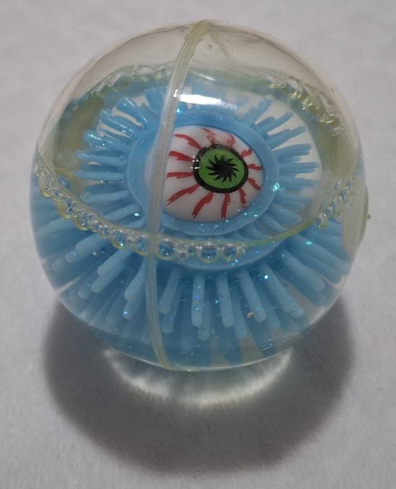 Gumowa kulka z okiem, brokatem, niebieska, 6cm (Zabawka)
