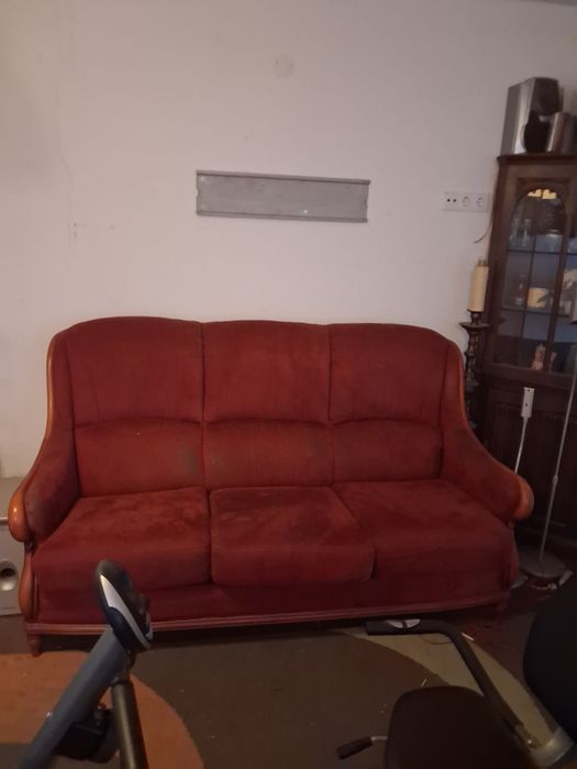 Um conjunto de sofás mais um móvel de canto