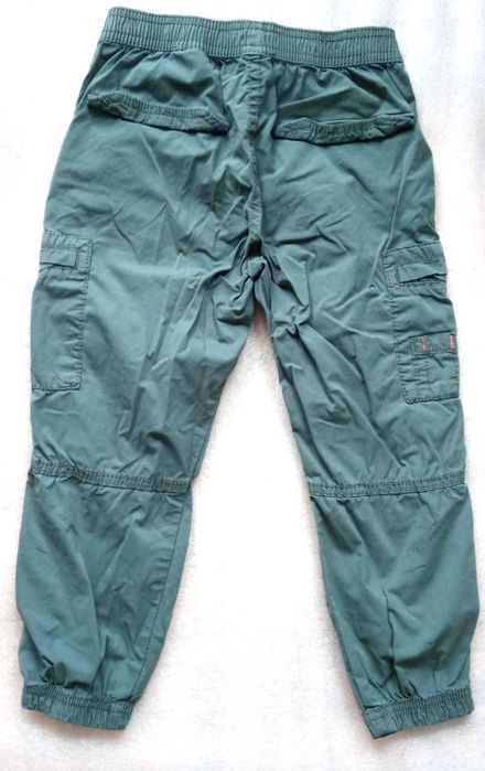 Spodnie H&M  przeciwdeszczowe rainwear chłopięce zielone rozmiar 110cm