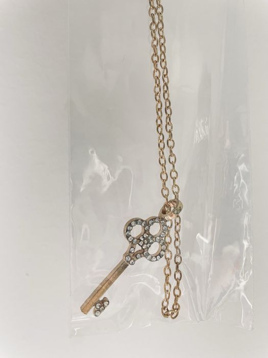 Lote de 10 fios dourados com pendente