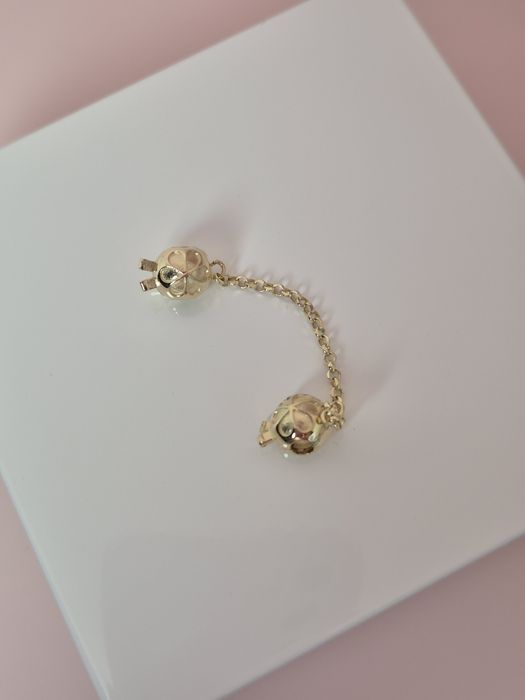 Złoty łańcuszek zabezpieczający gładki kulki kwiatk p. 585