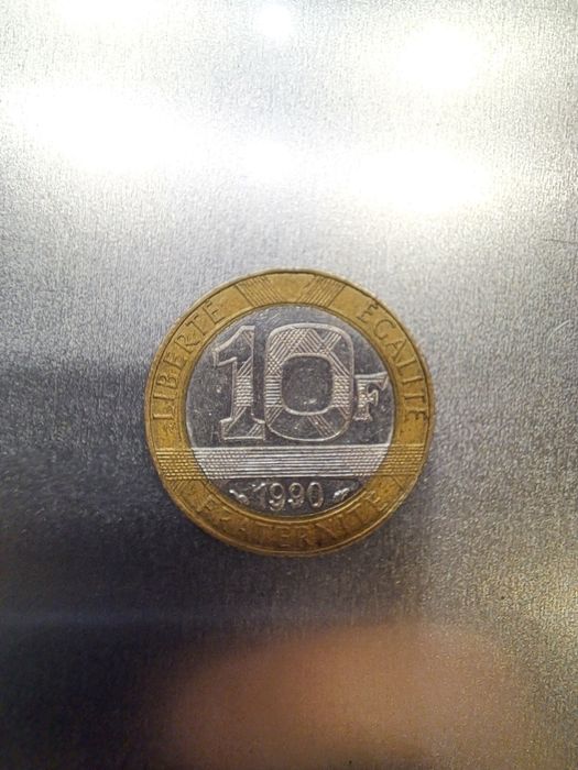 Moneta odwrócona 10 franków francuskich z 1990.