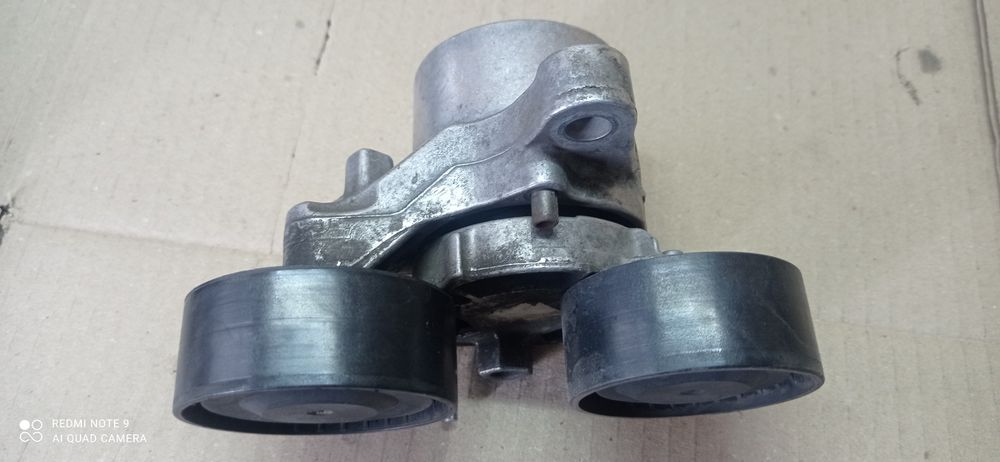 BMW. Натяжитель ремня генератора. 11287810807.