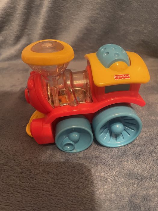 Іграшки від 6міс(пірамідка Tomy,паровозик FisherPrice, музич Пінгвін