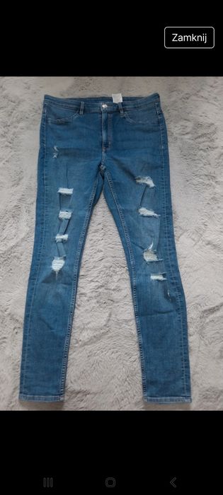 Spodnie jeansy damskie z przetarciami