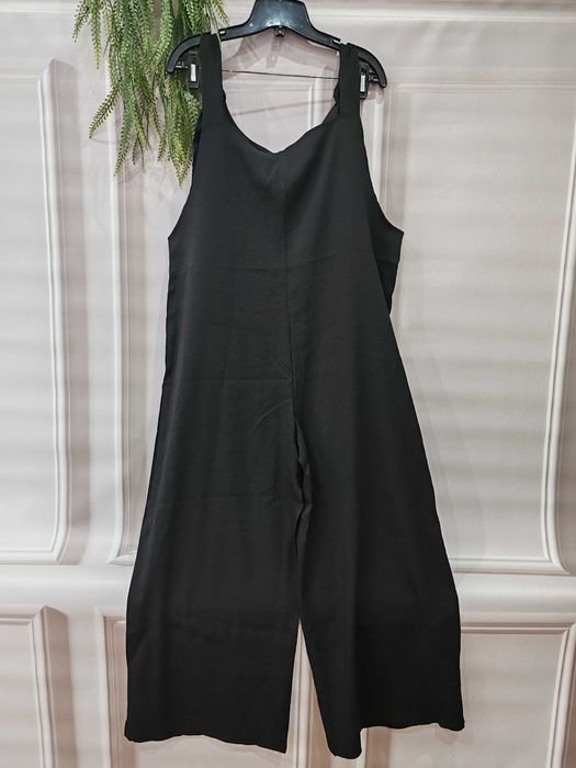 Czarny wygodny długi kombinzon rozmiar ok 44 poliester/spandex